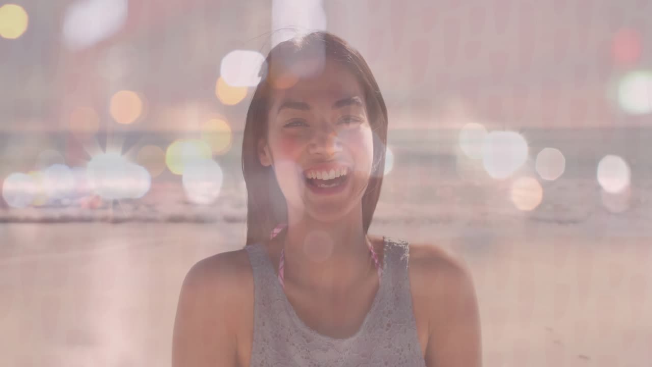 Sunlight driving bokeh lights on beach around woman shifting into smile and laughter for marketing
