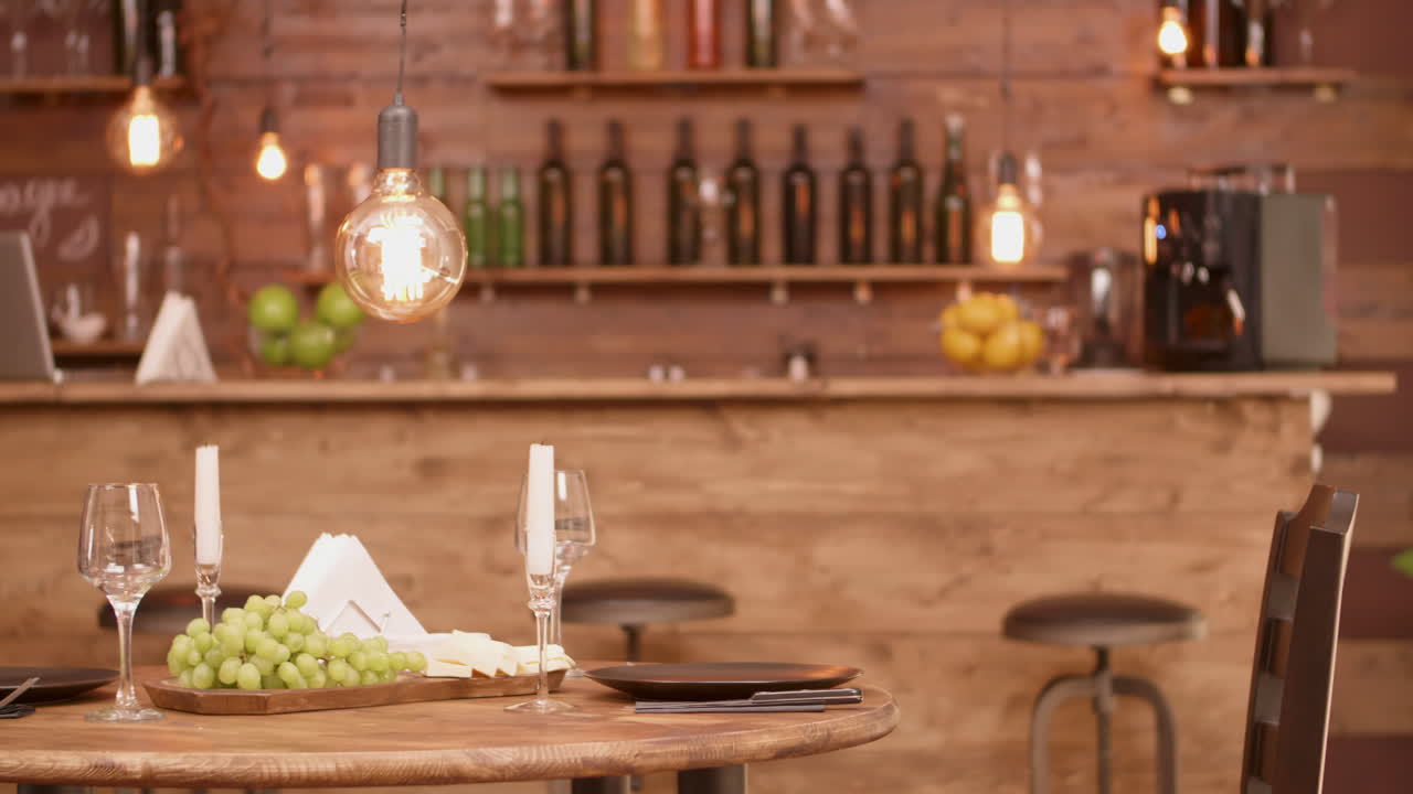 Table setting in a restaurant with grapes and wine glasses