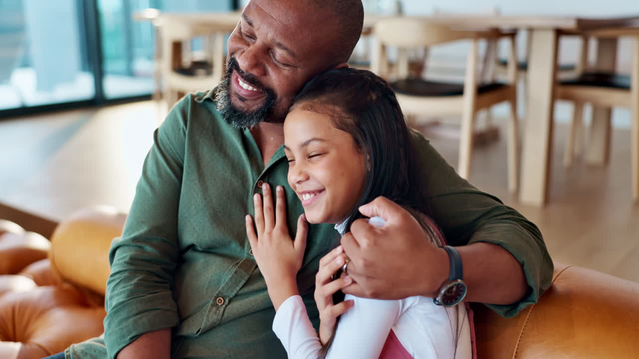 A father and daughter share a loving moment together