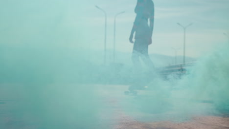 woman skateboarding on a city street with turquoise smoke