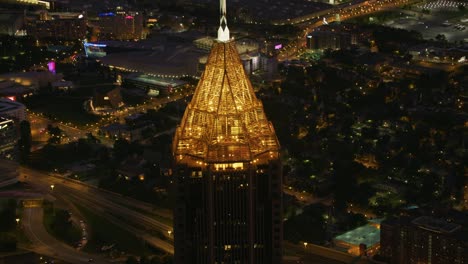 closeup aerial view of the bank of america plaza building in atlanta at night.