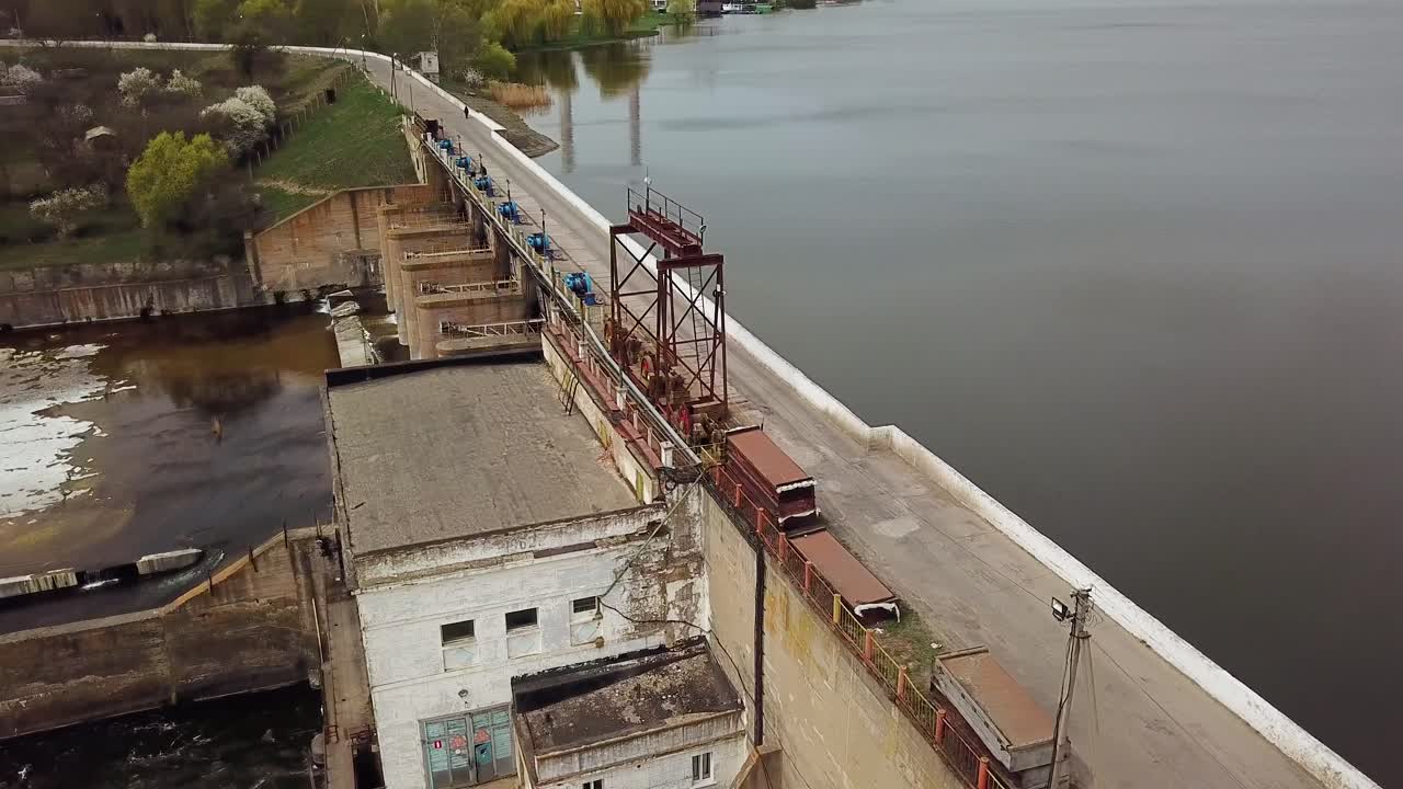 View of the treatment plant from above. Wastewater. Water sewage plant is on the river outside the city. Camera motion to right. Aerial view.