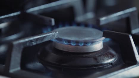 open gas stove in kitchen with fire blade. cooking dinner concept