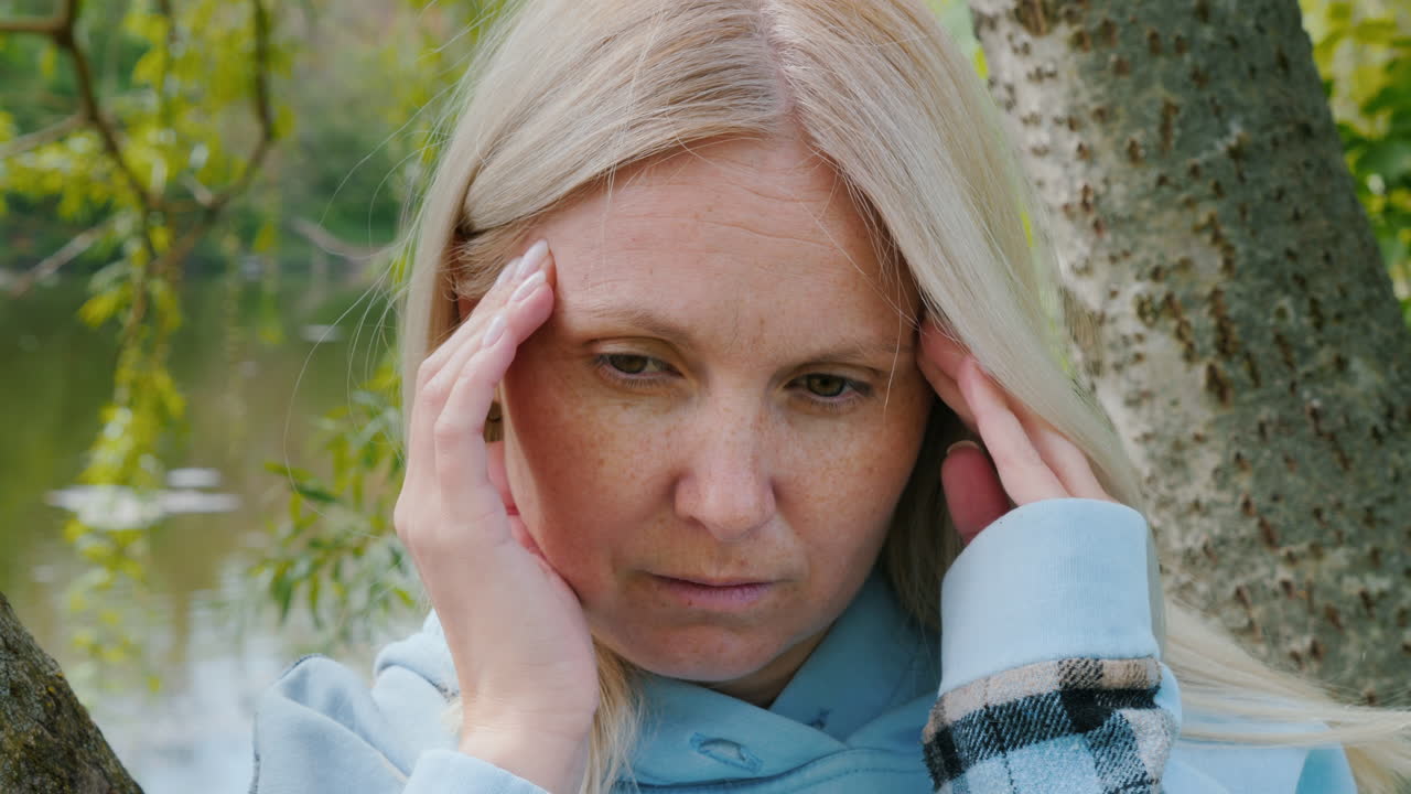 Woman experiencing a headache