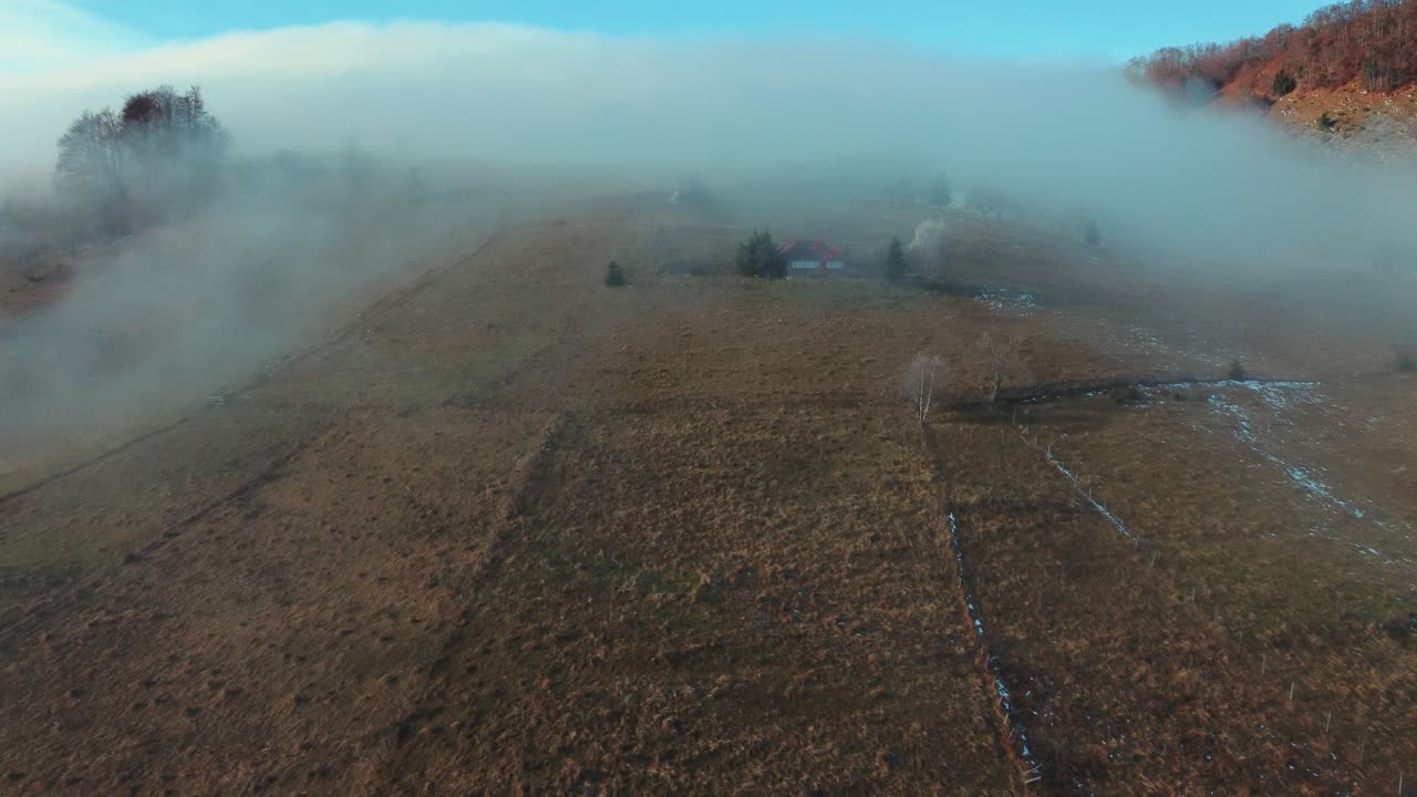 Fog over the hills of the mountain village of Sirnea in Romania