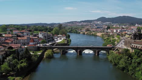 Barcelos’-medieval-bridge-stretching-over-the-tranquil-Cávado-River-amid-the-town's-historic-core