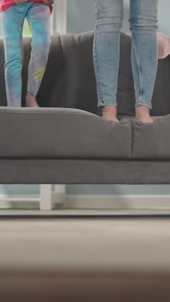 mother with children are going to break piggy bank standing on sofa, broken money