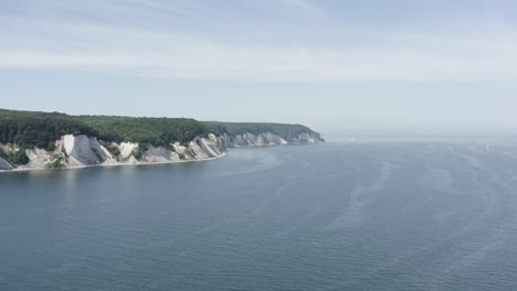 drone aerial shot of the chalk cliffs on ruegen rügen in germany in beautiful light with green and blue seawater, europe