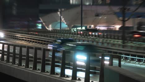 close-up time lapse traffic jam interchange overpass road at night, intersection roadway in modern big city in evening. timelapse town highway. cars moving fast drive way, lights trails