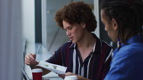 Diverse-business-colleagues-in-discussion-at-a-casual-meeting-in-the-office