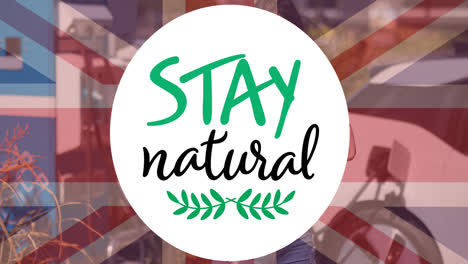 Stay-natural-text-over-flag-of-great-britain-and-charging-electric-car