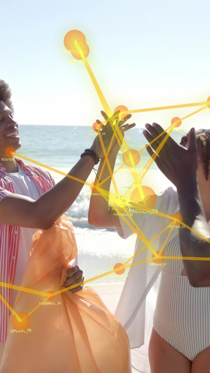 Vertical video: Woman raising hand, friends high-fiving on beach, network linking hands for tech