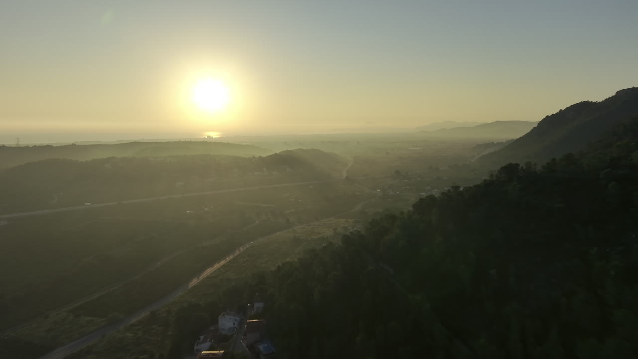 Sunrise over Coastal Mountains and Village