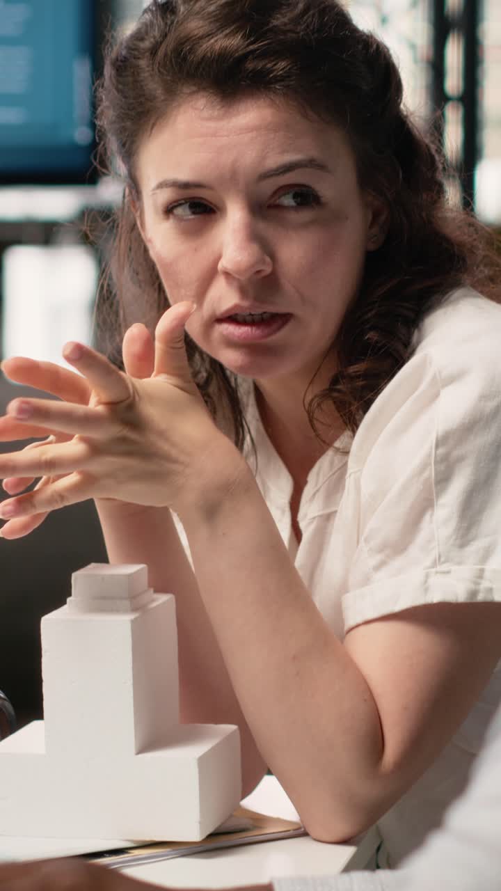 Vertical Video Diverse team of developers preparing property layouts and infrastructure designs