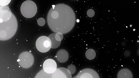 animación de puntos y nieve cayendo sobre un fondo negro