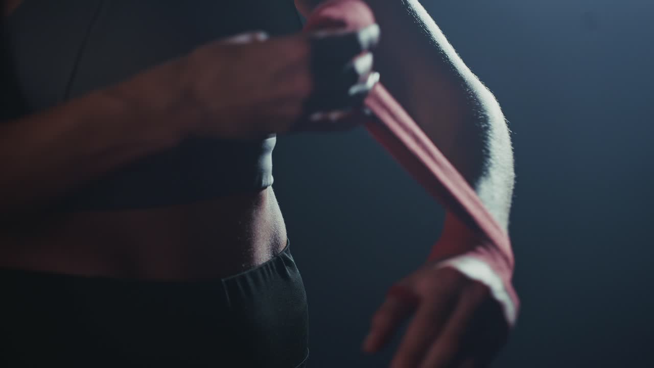 Close-up of Woman Wrapping Hands with Boxing Tape