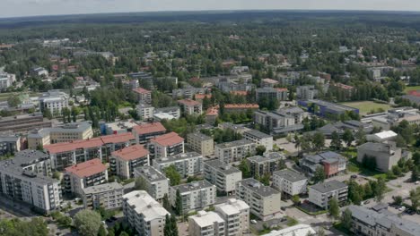 Aerial-view-about-a-city-near-Helsinki,-Finland-with-large-buildings-on-a-sunny-day