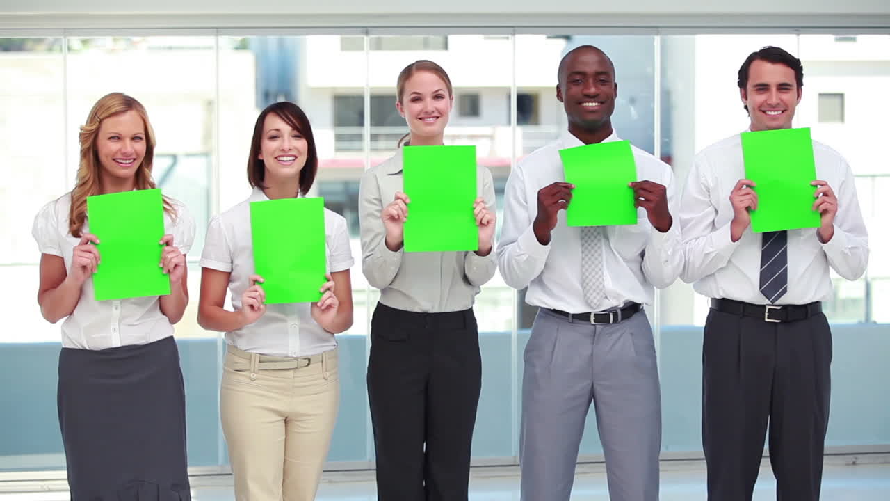 Five business people holding signs