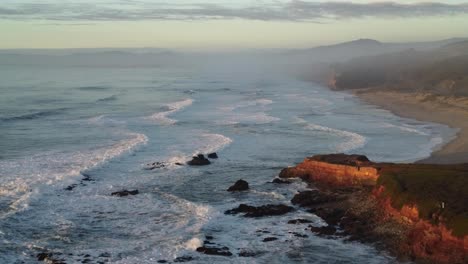 slowly moving aerial footage along pescadero state beach