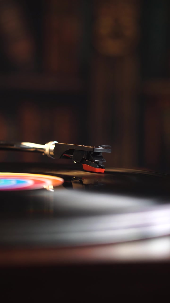 Vertical View, Needle of Spinning Vinyl Record in Room Ambience, Close Up