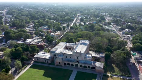 aerial orbit to the left centered on the convent de san bernardino in valladolid, yucatan, mexico in early morning