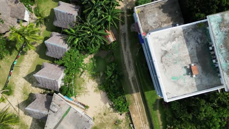 Traditional-Hut-And-Palm-Trees-At-The-Resort-In-Baras,-Catanduanes,-Bicol,-Philippines