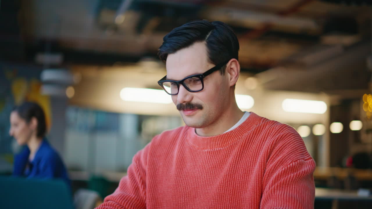 Friendly coworkers smiling together at shared workplace closeup. Happy man woman