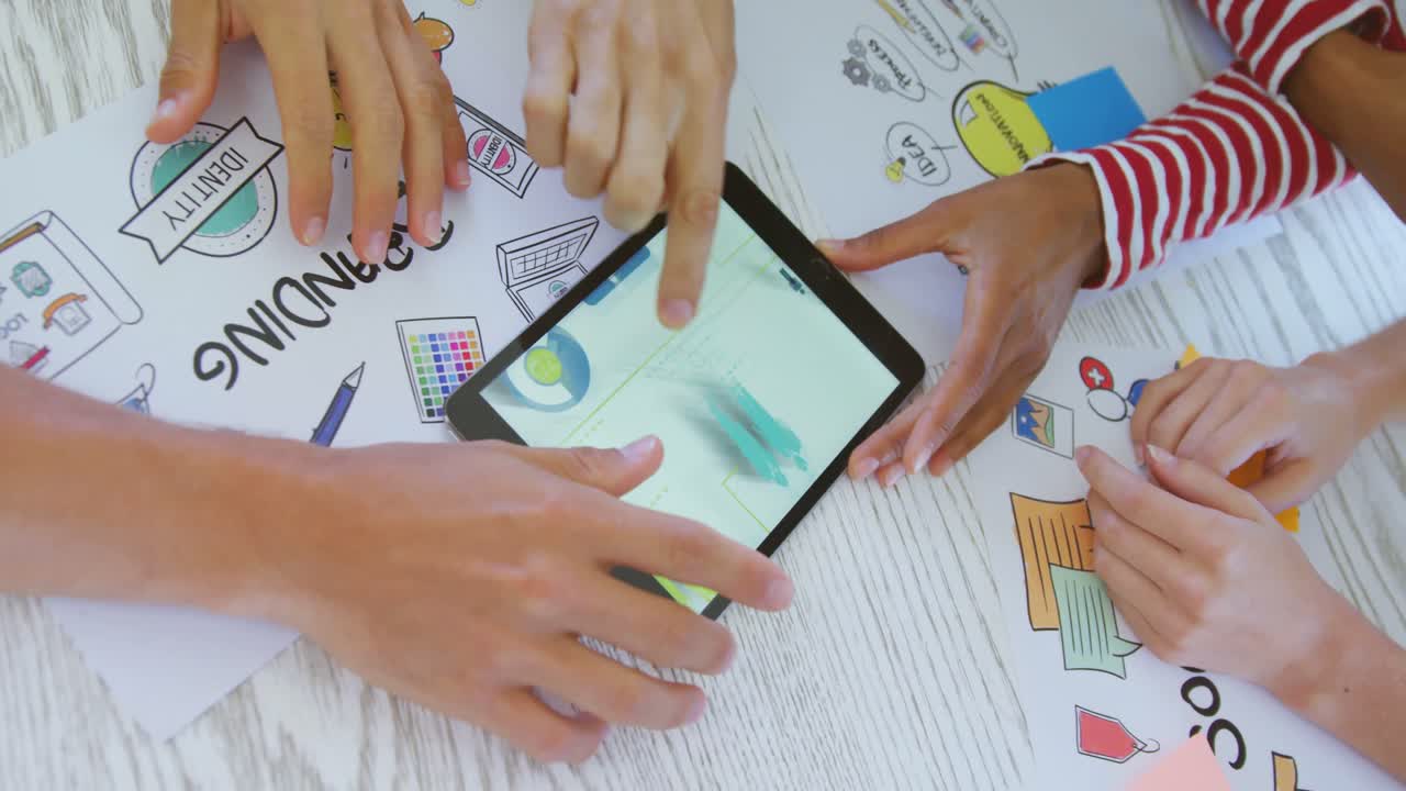 Hands of colleagues using digital tablet at table 4k