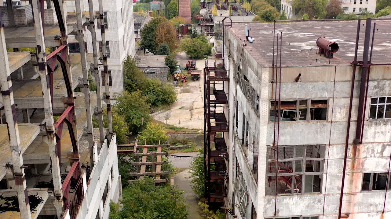 Aerial view of destructive abandoned architecture. Industrial destroyed city buildings.