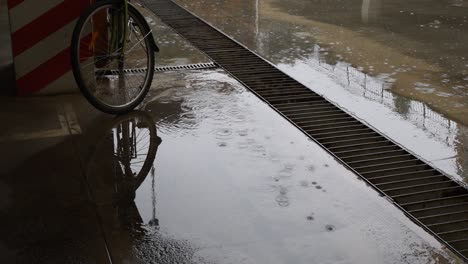 drizzle rain in the city parking with bike parked