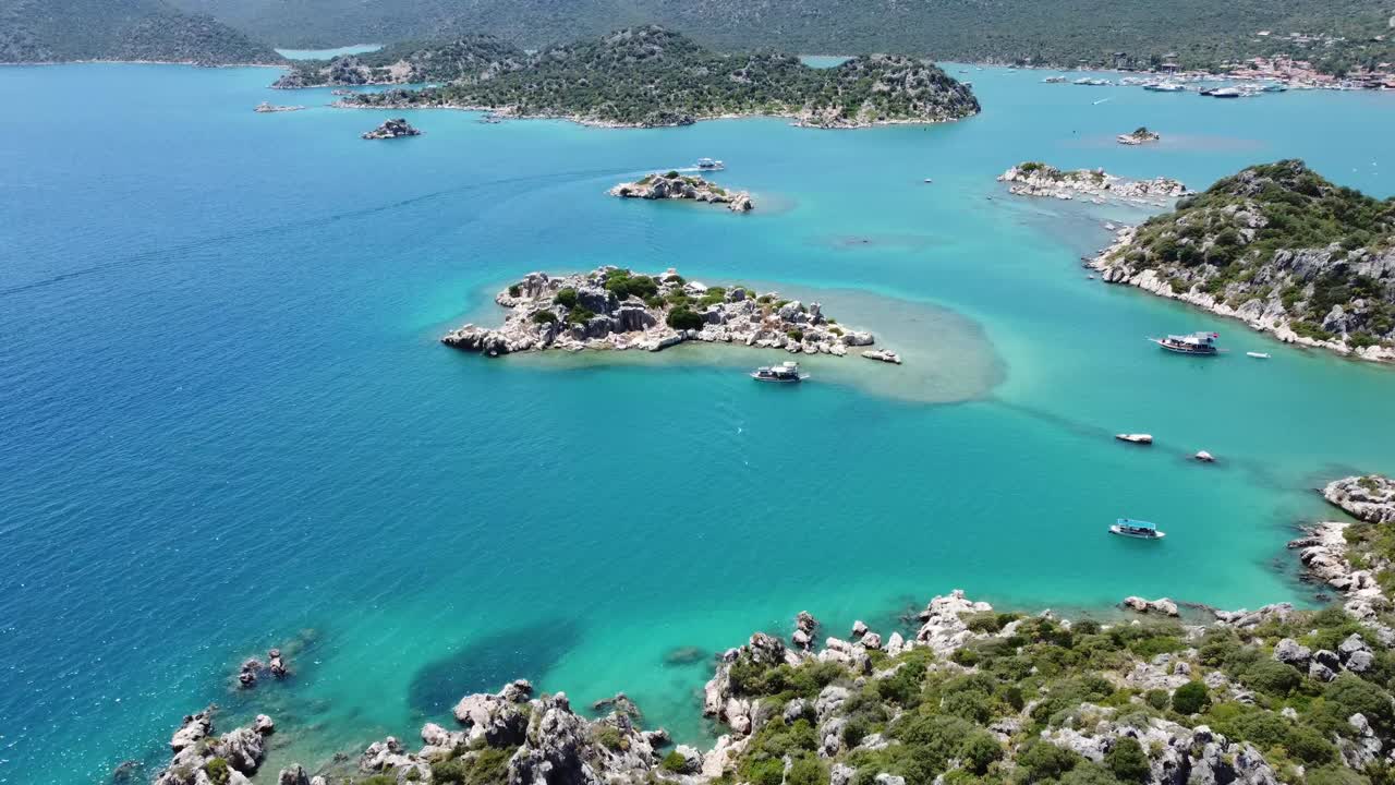 Aerial drone shot showing turquoise channels winding around verdant islets of Twelve Islands archipelago near Gocek in Fethiye Bay Mugla Province during bright calm summer conditions