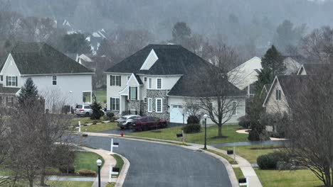 aerial rising shot over a neighborhood street