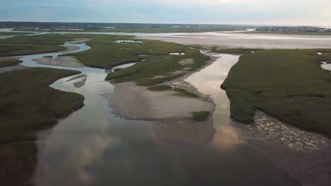 drone flyover of mason inlet marsh headed towards figure eight island in wilmington north carolina