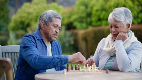 Senior-man,-woman-and-chess-in-park