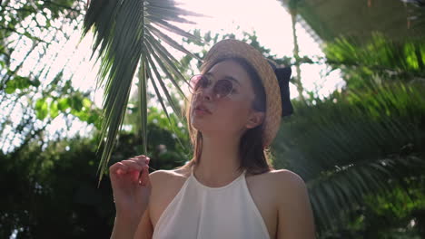 woman in a tropical greenhouse