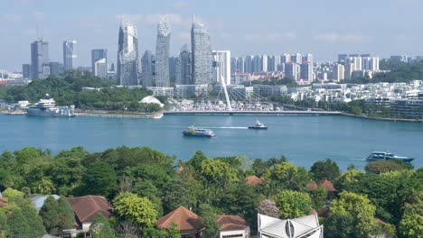 slow motion landscape view of keppel harbour waterfront marina with singapore city skyline cbd from sentosa island asia travel architecture