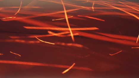 burning red hot sparks rise. beautiful abstract background. fast flying luminous sparks from the fire close-up