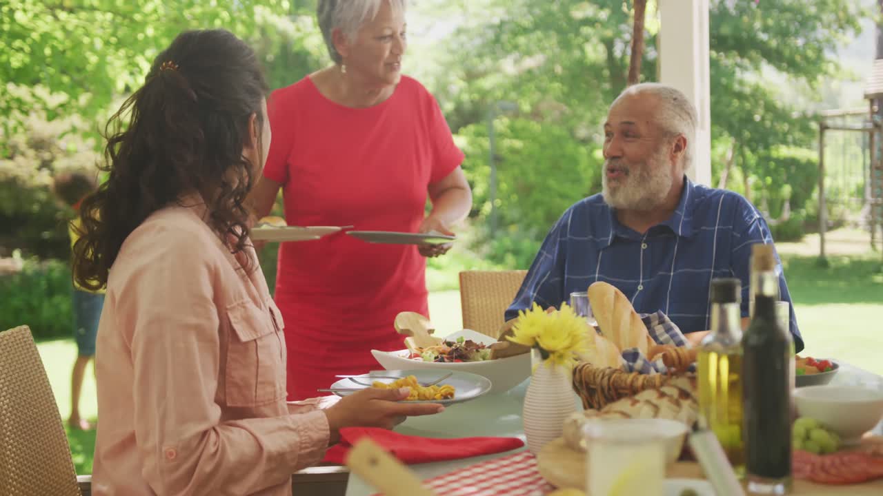Multi-generation African American family spending time in garden together