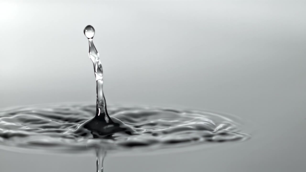 Water Drop Falling in Slow Motion Creating Crown Splash and Ripples