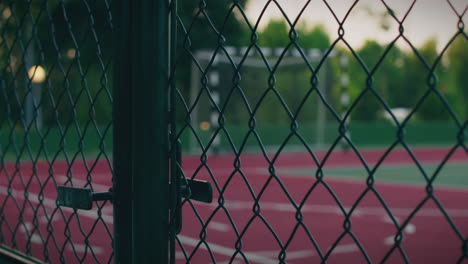 outdoor court fence view close up gate shot slow motion