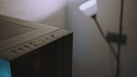 close-up of a computer case with glowing power button