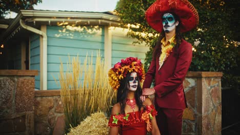 couple in day of the dead costumes