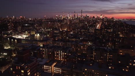 aerial view of the new york city skyline at dusk. shot in harlem looking south towards midtown manhattan.