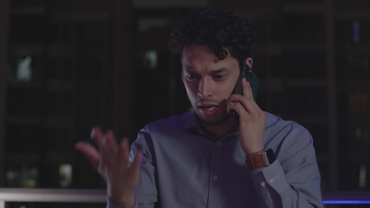 Businessman having phone conversation, getting mad about bad news, stressful job