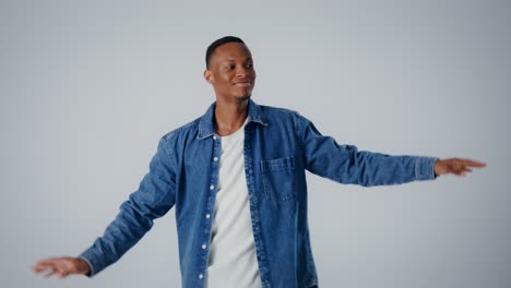 happy man dancing in denim shirt