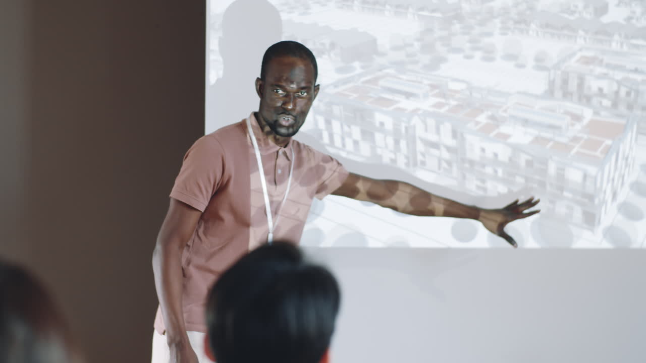 African American Man Giving Presentation on Architecture Conference