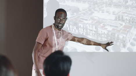 african american man giving presentation on architecture conference