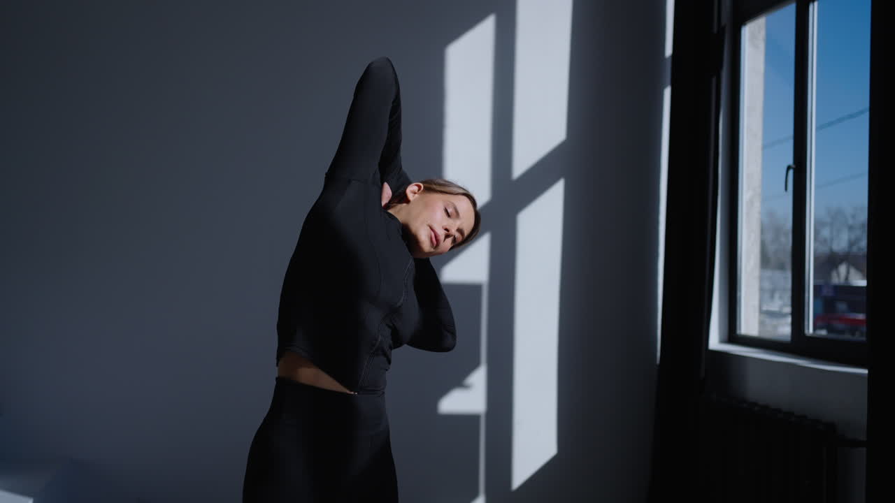 Woman stretching in a gym