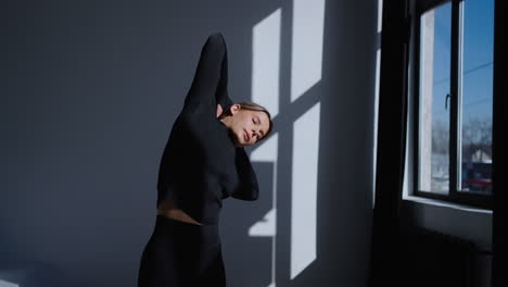 woman stretching in a gym