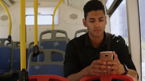 Male-commuter-using-mobile-phone-while-travelling-in-bus-4k